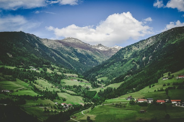 Green valley with mountains and a village
