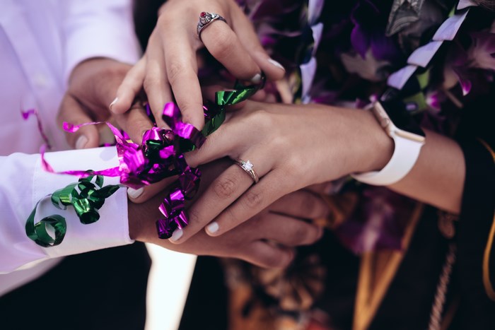 Couple's Hands with Engagement Ring and Apple Watch