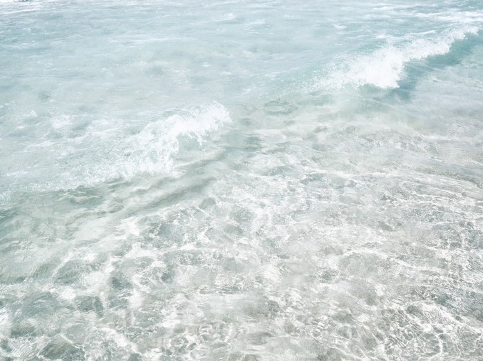 Clear ocean water with gentle waves near Menorca