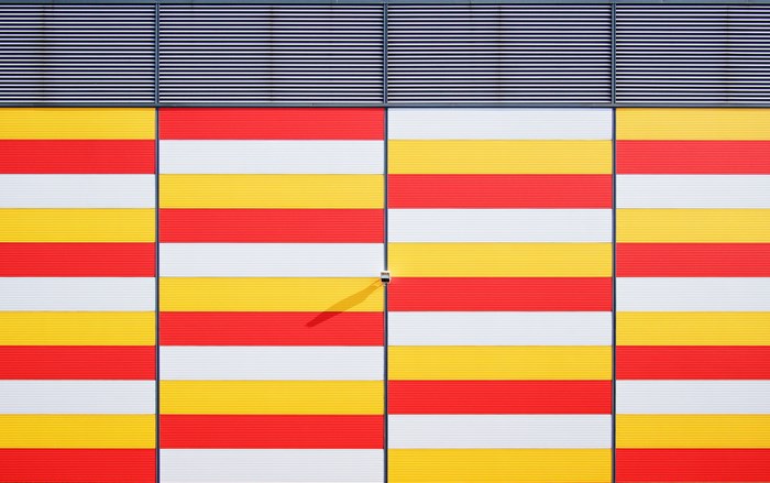 Abstract Red Yellow White Horizontal Stripes Building Facade