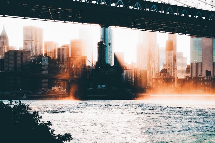 New York City skyline with Brooklyn Bridge and river