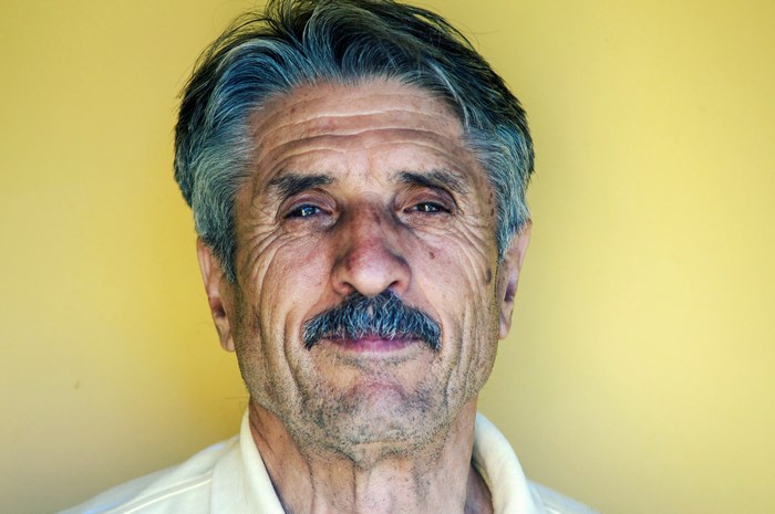 Portrait of an elderly man with a mustache