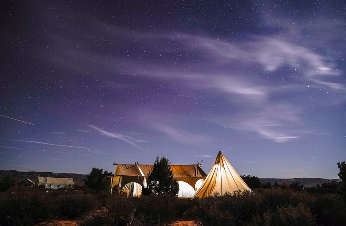 Tents under a starry night sky