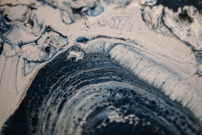 Abstract paint cells with blue and white swirls