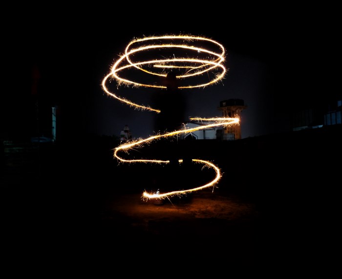 Long exposure light painting with sparklers at night