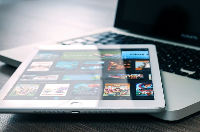 Apple iPad and MacBook Pro on a wooden table