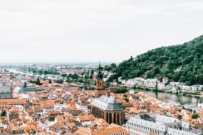 Heidelberg cityscape with river and forested hill