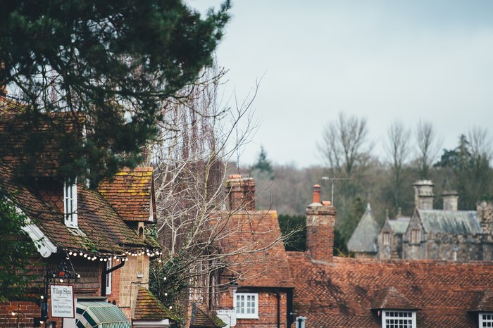 Village shop with tiled roofs and chimneys