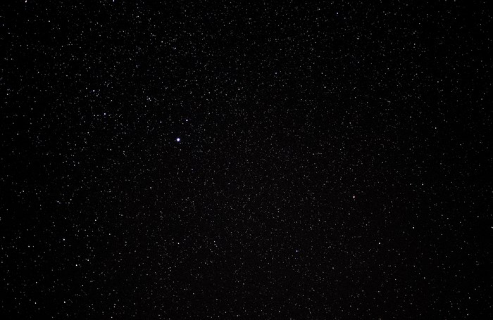Starry night sky with bright stars