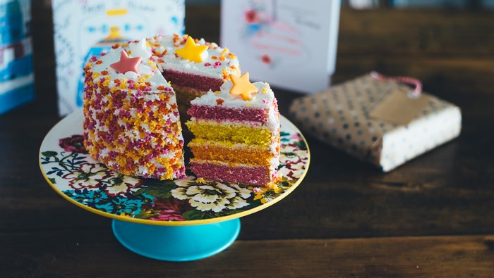 Colorful Rainbow Layered Birthday Cake with Star Decorations