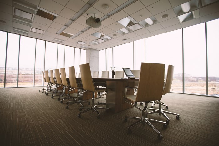 Conference room with large windows and a long table