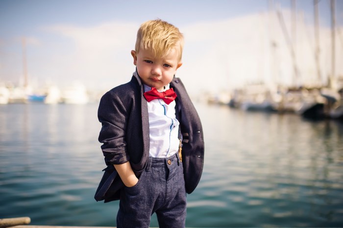Stylish Young Boy Posing by the Water