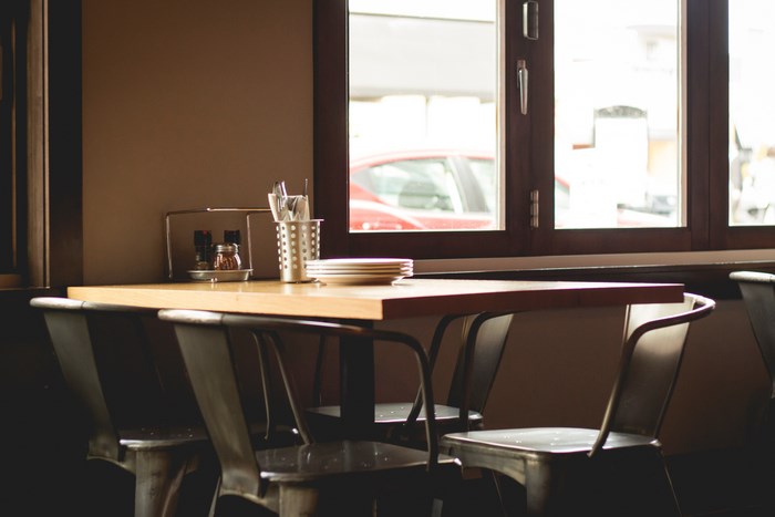 Restaurant table with chairs and window view