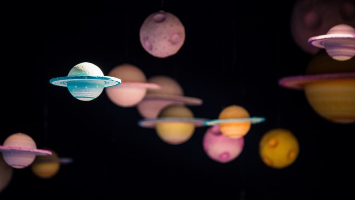 Model planets hanging in a dark room