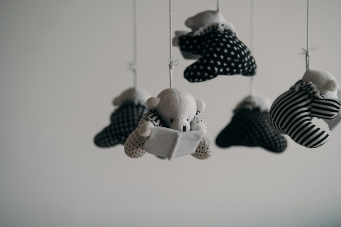 Black and white teddy bear mobile with reading bear