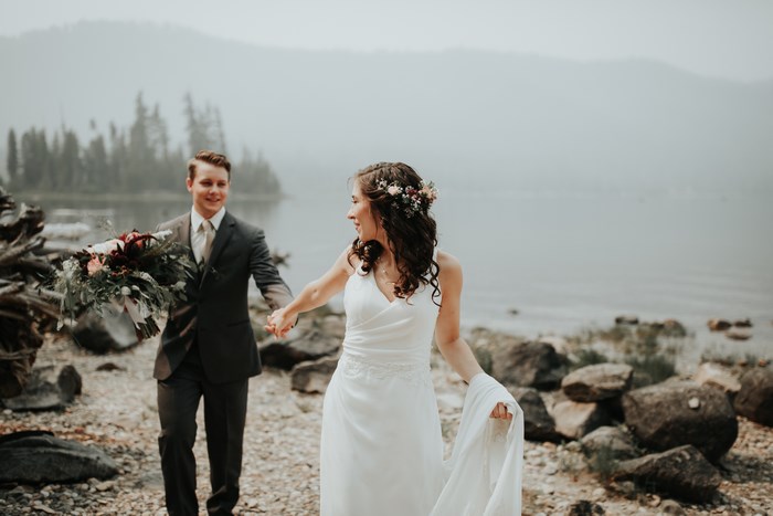 Wedding Couple Holding Hands by Lake Wenatchee