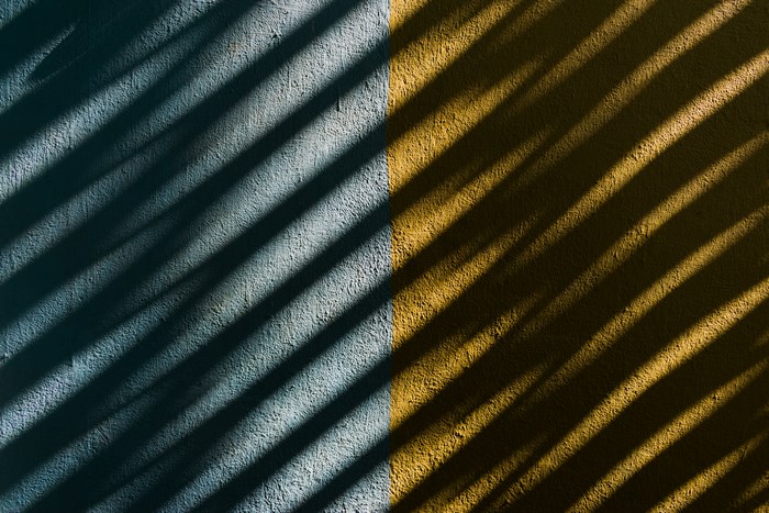 Diagonal shadows on a textured wall