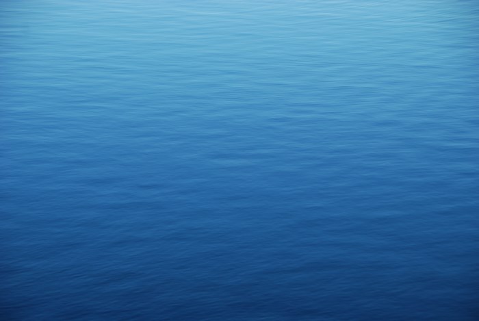 Blue water with ripples and gradient