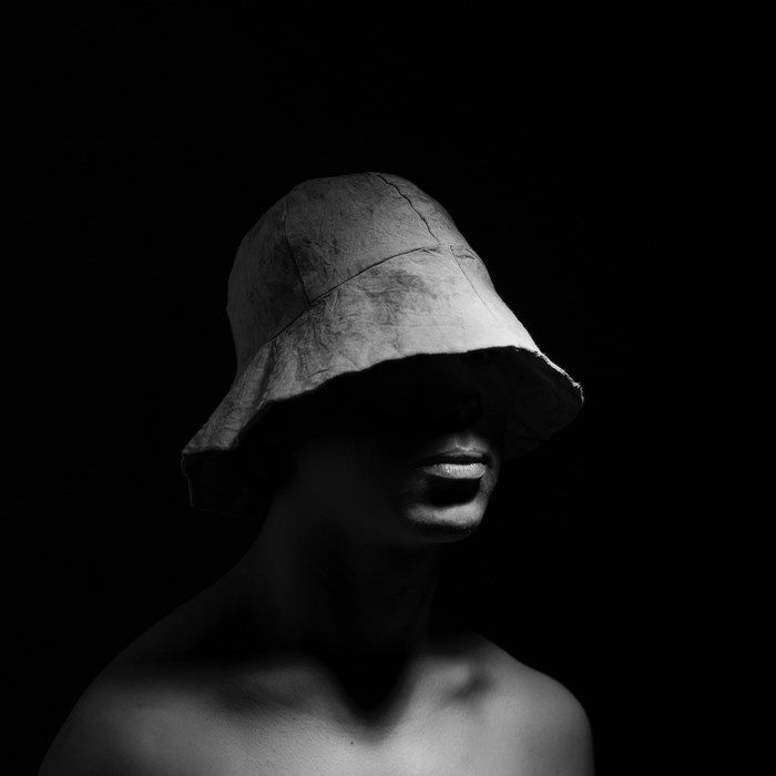 Man wearing a bucket hat in black and white