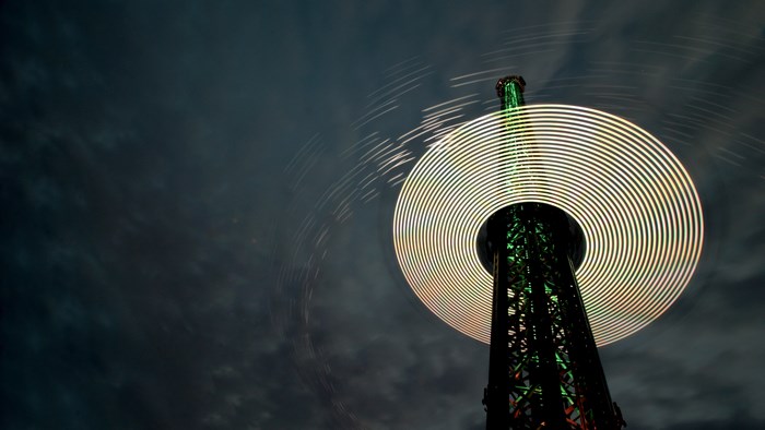 Long exposure of a spinning tower at night