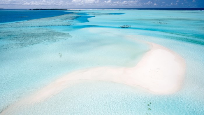 Aerial view of a tropical sand bank in turquoise water
