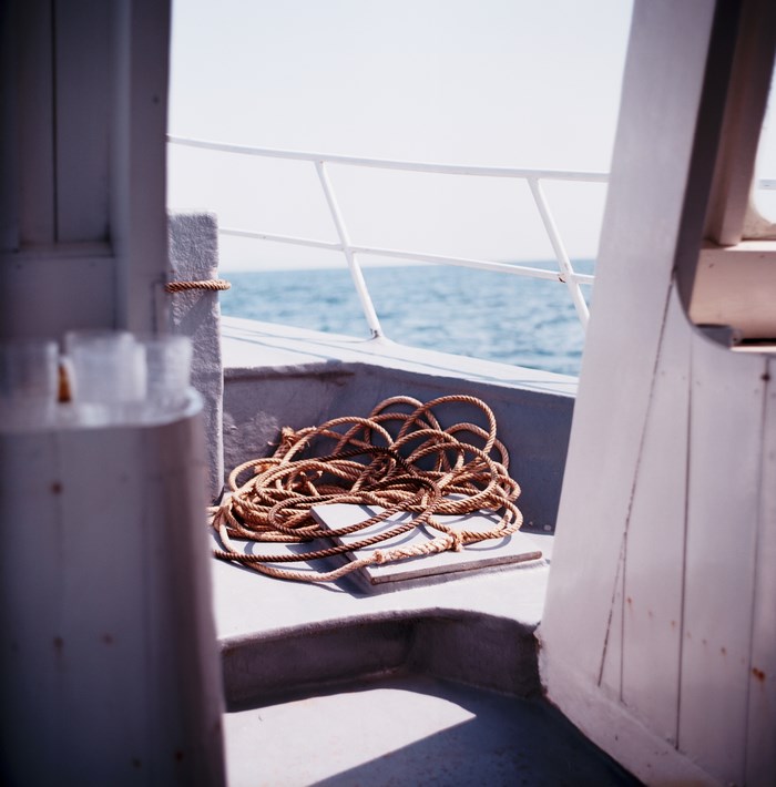 Rope on a boat deck with the sea in the background