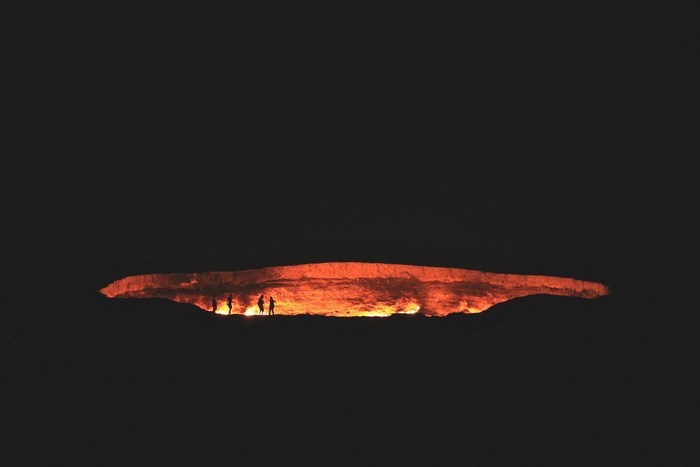 Darvaza gas crater at night with people