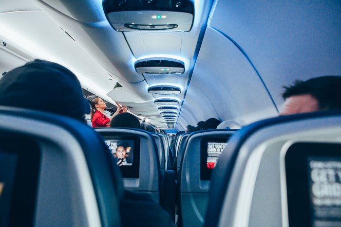 Airplane Cabin Interior with Blue Lighting and Seats