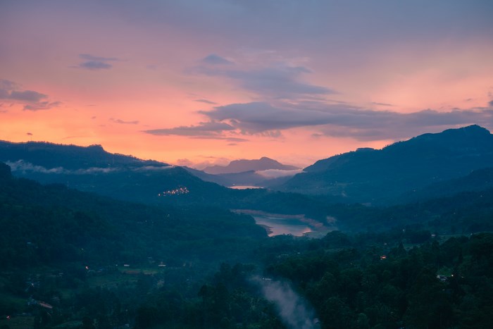 Sunset over mountains and lake in Sri Lanka