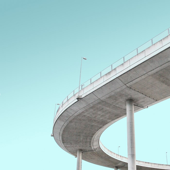 Concrete overpass against a clear blue sky