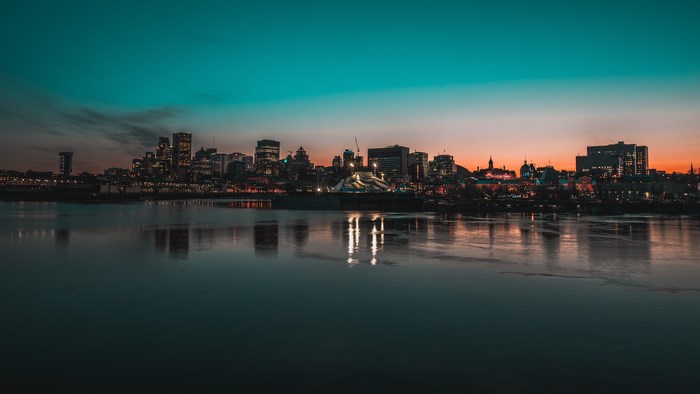 Sunrise over Quebec City Skyline with Waterfront Reflection