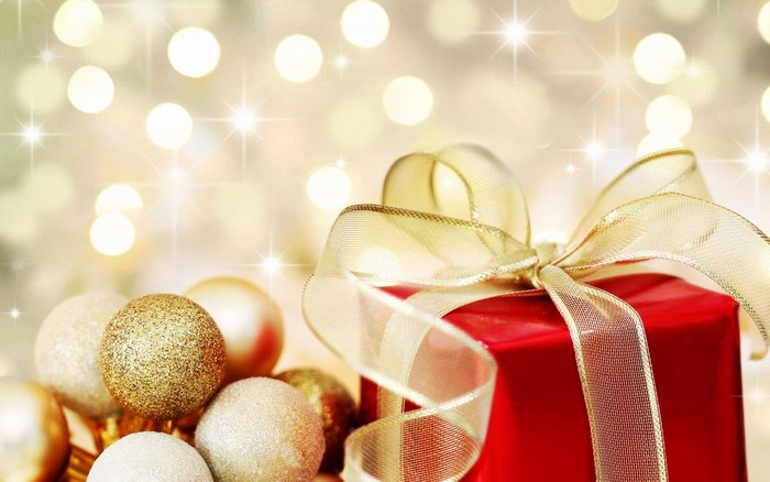 Christmas gift with ornaments and bokeh lights