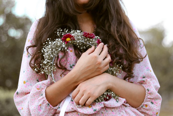 Woman holding a flower crown