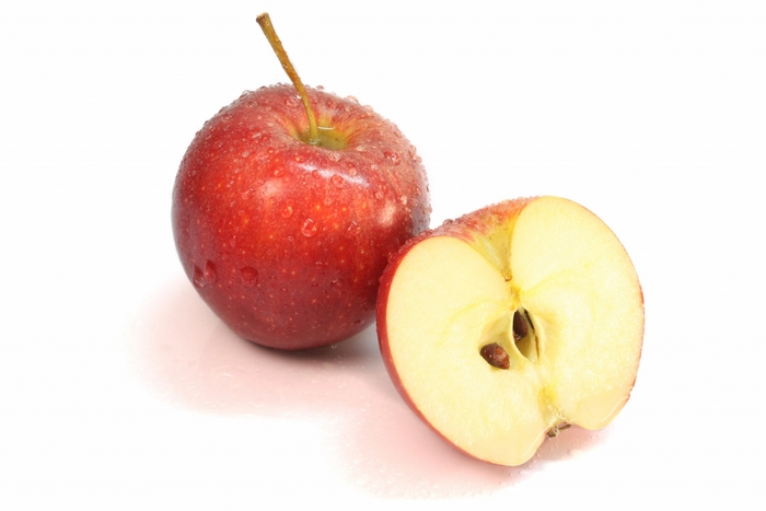 Red apple and half apple with seeds