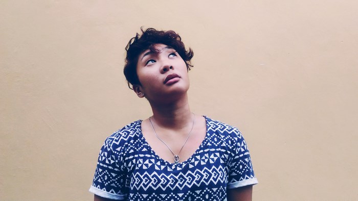 Woman with short hair looking up
