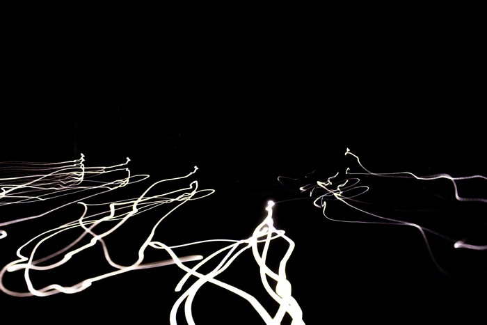Abstract light trails on a black background