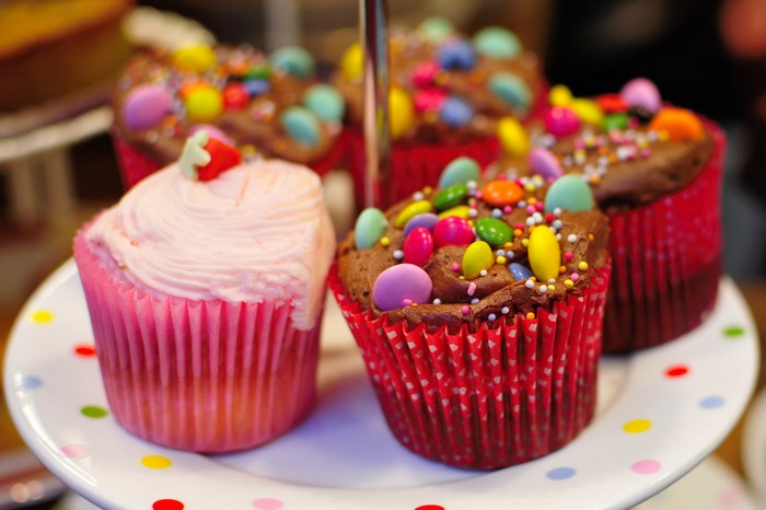 Colorful Cupcakes with Candy Toppings on Plate