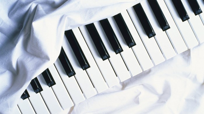 Piano Keys Covered by White Fabric