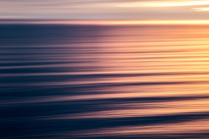 Abstract sunset over the ocean with horizontal stripes