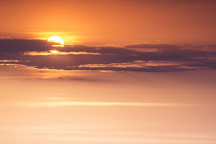 Sunset with orange sky and clouds