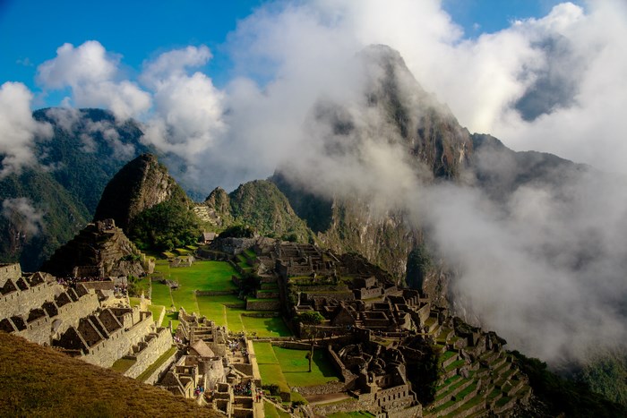Machu Picchu ruins in Peru with clouds