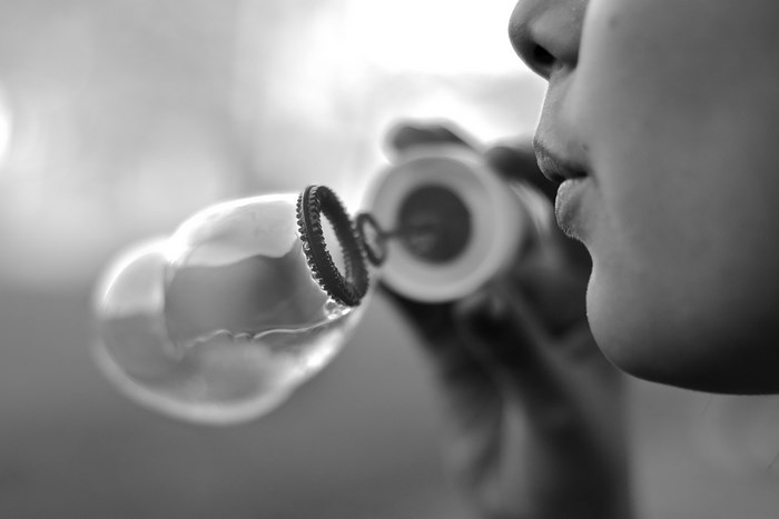 Close-up of a child blowing bubbles