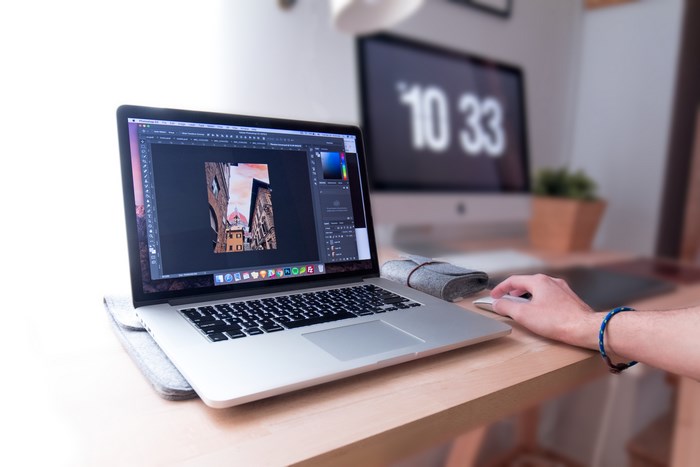 Modern workspace with laptop and desktop monitor
