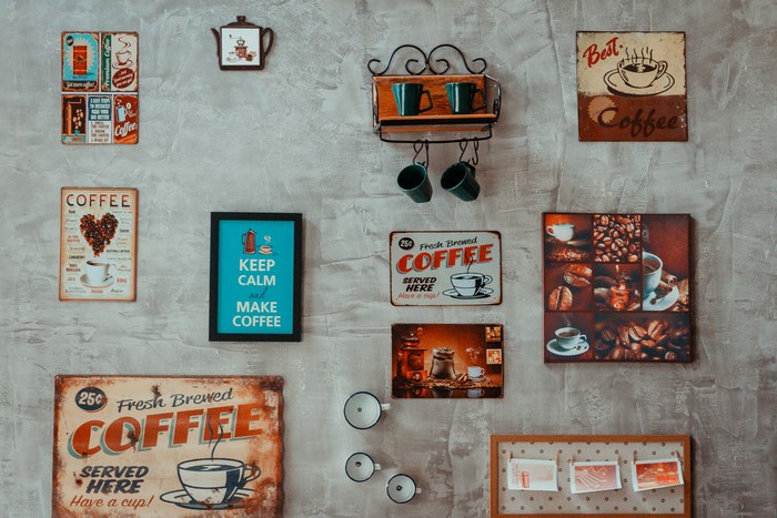 Coffee-themed decorations on a textured wall