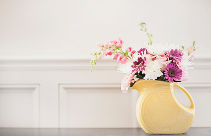 Yellow Fiesta Ware Pitcher with Pink and White Flowers