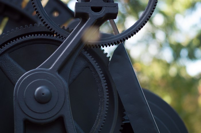 Close-up of black metal gears and machinery