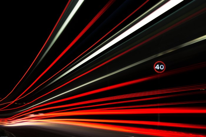 Long exposure light trails with speed limit sign