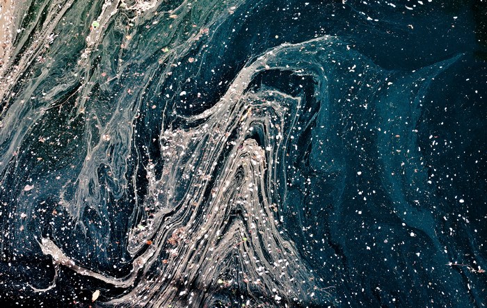 Abstract liquid texture with white particles