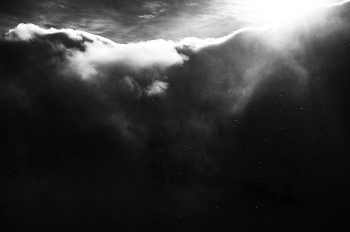 Sunlight breaking through dark clouds