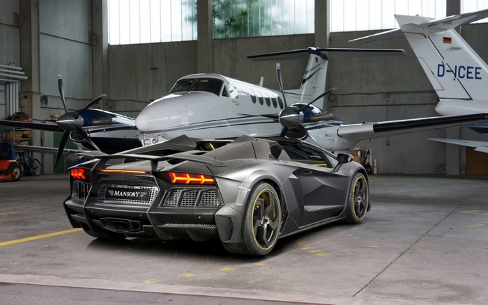 Mansory Lamborghini Aventador parked in hangar with private jets